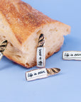 "Life is Pain" Baguette enamel PIN